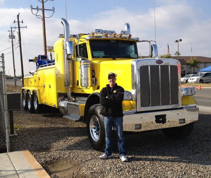 The fearless leader of Rocklin Ace Towing, Shawn Nelson, standing in front of a very big unit he transported to California from the East Coast. Every once in a while, he puts his Class A license to work and gets behind the wheel of one of these monster tow trucks.